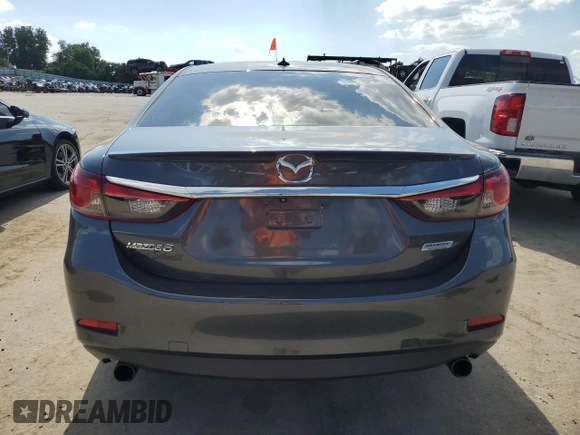 2014 Mazda 6 i Grand Touring с VIN JM1GJ1W67E1135264, выставлен на аукционе Copart как лот 70587624 с пробегом 86 926 миль миль и Списание • Salvage title. История ставок и продаж доступна на DreamBid. Изображение 6.