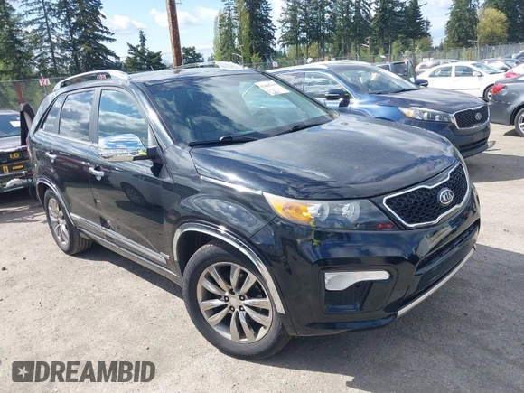 2012 Kia Sorento SX with VIN 5XYKWDA26CG258262, listed as a IAAI auction lot 42068704 with 124,832 mi miles. Bid and sale history available at carsss.com. Image 1.