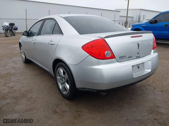 2009 Pontiac G6 w/1SA *Ltd Avail* with VIN 1G2ZG57B994123359, listed as a IAAI auction lot 41492389 with 128489 miles. Bid and sale history available at carsss.com. Image 3.