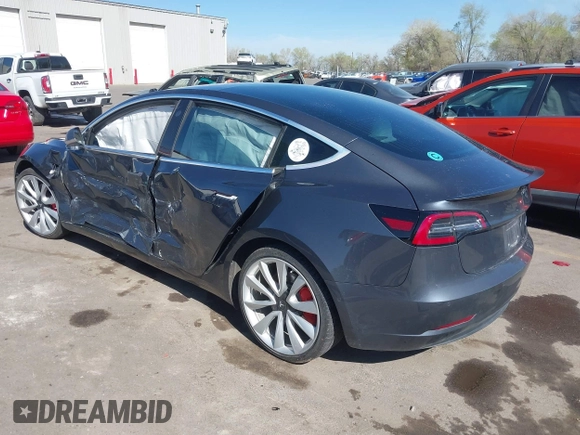 2018 Tesla Model 3 Long Range Battery with VIN 5YJ3E1EBXJF055203, listed as a IAAI auction lot 42019770 with 57,379 mi miles and . Bid and sale history available at DreamBid. Image 3.