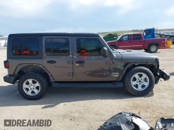 2019 Jeep Wrangler Unlimited Sport S with VIN 1C4HJXDG0KW541940, listed as a IAAI auction lot 42100255 with 68,309 mi miles and . Bid and sale history available at DreamBid. Image 14.