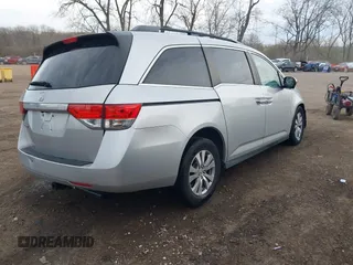 2014 Honda Odyssey EX-L with VIN 5FNRL5H65EB096544, listed as a IAAI auction lot 41903451 with 99,628 mi miles and . Bid and sale history available at carsss.com. Image 4.
