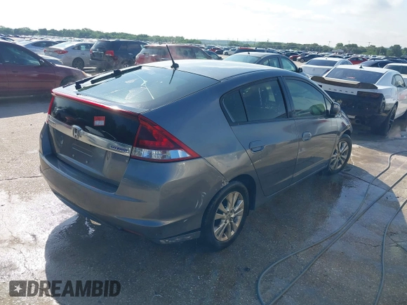2013 Honda Insight EX with VIN JHMZE2H74DS002123, listed as a IAAI auction lot 42204860 with 279,376 mi miles and . Bid and sale history available at DreamBid. Image 4.