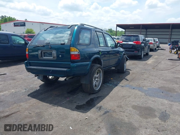 1999 Isuzu Rodeo S with VIN 4S2CK58W6X4332027, listed as a IAAI auction lot 42087396 with 258,508 mi miles and . Bid and sale history available at DreamBid. Image 4.
