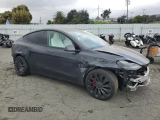 2024 Tesla Model Y Performance with VIN 7SAYGDEF7RF093054, listed as a Copart auction lot 50747985 with 26,907 mi miles and Salvage Title. Bid and sale history available at DreamBid. Image 4.