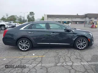2013 Cadillac XTS Luxury with VIN 2G61P5S33D9215214, listed as a IAAI auction lot 42170402 with 132,045 mi miles and . Bid and sale history available at DreamBid. Image 13.