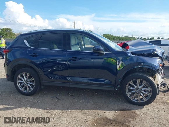 2021 Mazda CX-5 Grand Touring with VIN JM3KFADM0M0469886, listed as a IAAI auction lot 41617270 with 33,571 mi miles. Bid and sale history available at carsss.com. Image 14.