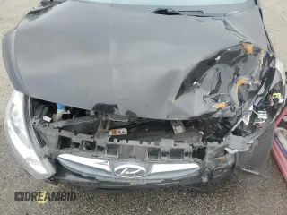 2014 Hyundai Accent GLS z VIN KMHCT4AE6EU705838, wystawiony jako Copart lot #58581515 z przebiegiem 40 265 mil mil oraz Szkoda całkowita • Salvage title. Historia ofert i sprzedaży dostępna na DreamBid. Obrazek 11.