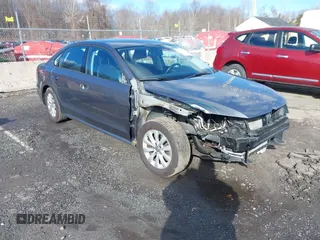 2015 Volkswagen Passat 1.8T Limited Edition with VIN 1VWAT7A37FC002698, listed as a IAAI auction lot 41736982 with 116,540 mi miles. Bid and sale history available at carsss.com. Image 1.