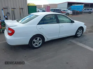 2002 Toyota Camry LE z VIN JTDBE32K020030113, wystawiony jako IAAI lot #41210452 z przebiegiem 190 486 mil mil oraz . Historia ofert i sprzedaży dostępna na DreamBid. Obrazek 4.