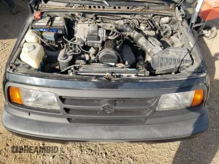 1998 Suzuki Sidekick JS z VIN 2S3TE02V1W6402490, wystawiony jako Copart lot #78316244 z przebiegiem 79 724 mil mil oraz Tytuł czysty. Historia ofert i sprzedaży dostępna na DreamBid. Obrazek 11.