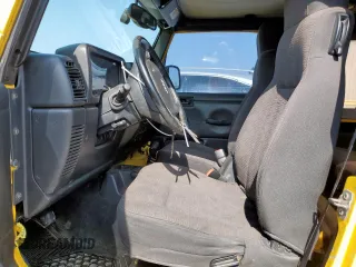 2003 Jeep Wrangler Sport with VIN 1J4FA49S43P369906, listed as a Copart auction lot 58079235 with 139,547 mi miles and Salvage title. Bid and sale history available at DreamBid. Image 7.
