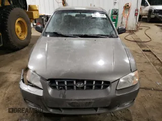 2000 Hyundai Accent z VIN KMHCG45G4YU090520, wystawiony jako Copart lot #79705864 z przebiegiem 145 490 mil mil oraz Szkoda całkowita • Salvage title. Historia ofert i sprzedaży dostępna na DreamBid. Obrazek 5.