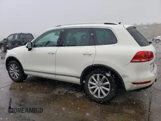 2011 Volkswagen Touareg Sport with VIN WVGFF9BP8BD002982, listed as a Copart auction lot 53958555 with 156,742 mi miles and Salvage Title. Bid and sale history available at DreamBid. Image 2.