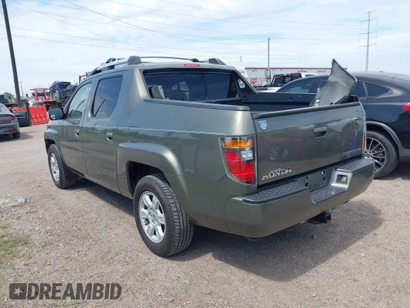2007 Honda Ridgeline RTL with VIN 2HJYK16577H537990, listed as a IAAI auction lot 42454619 with 182,911 mi miles and . Bid and sale history available at DreamBid. Image 3.