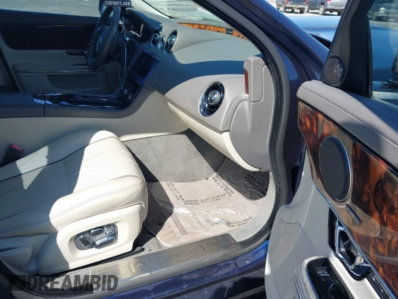 2014 Jaguar XJ Portfolio with VIN SAJWA2GZ4E8V60251, listed as a IAAI auction lot 41778702 with 45,180 mi miles and . Bid and sale history available at DreamBid. Image 5.