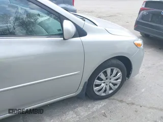 2013 Toyota Corolla L with VIN 2T1BU4EEXDC052854, listed as a IAAI auction lot 42230118 with 156,120 mi miles and . Bid and sale history available at DreamBid. Image 19.