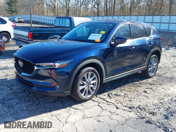 2021 Mazda CX-5 Grand Touring with VIN JM3KFADM5M0428279, listed as a IAAI auction lot 41747175 with 49,579 mi miles. Bid and sale history available at carsss.com. Image 18.