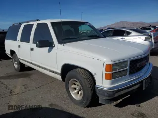 1999 GMC Suburban with VIN 3GKEC16R6XG538009, listed as a Copart auction lot 87112424 with 220,487 mi miles and Clean Title. Bid and sale history available at DreamBid. Image 4.