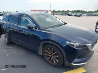 2019 Mazda CX-9 Grand Touring z VIN JM3TCADY5K0315526, wystawiony jako IAAI lot #42247718 z przebiegiem 75 476 mil mil oraz . Historia ofert i sprzedaży dostępna na DreamBid. Obrazek 1.