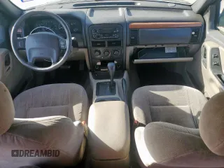 1999 Jeep Grand Cherokee Laredo with VIN 1J4G258S0XC561054, listed as a Copart auction lot 49814555 with Not provided miles and Salvage title. Bid and sale history available at DreamBid. Image 8.
