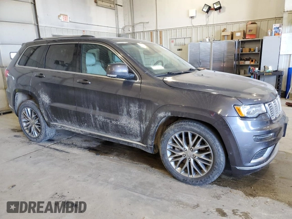 2017 Jeep Grand Cherokee Summit with VIN 1C4RJFJT4HC723876, listed as a Copart auction lot 52647205 with 97,412 mi miles and Salvage title. Bid and sale history available at DreamBid. Image 4.