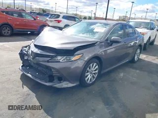 2020 Toyota Camry LE with VIN 4T1C11AK3LU363417, listed as a IAAI auction lot 41430382 with 130,837 mi miles. Bid and sale history available at carsss.com. Image 2.