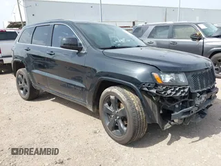 2015 Jeep Grand Cherokee Altitude z VIN 1C4RJFAG0FC940115, wystawiony jako IAAI lot #42642436 z przebiegiem 117 435 mil mil oraz . Historia ofert i sprzedaży dostępna na DreamBid. Obrazek 1.