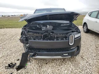 2022 Rivian R1T Adventure z VIN 7FCTGAAA5NN015734, wystawiony jako Copart lot #44019715 z przebiegiem 27 542 mil mil oraz Szkody całkowita. Historia ofert i sprzedaży dostępna na DreamBid. Obrazek 5.