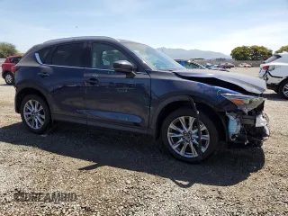 2020 Mazda CX-5 Grand Touring z VIN JM3KFADM4L0794765, wystawiony jako Copart lot #63850005 z przebiegiem 53 270 mil mil oraz Szkoda całkowita • Salvage title. Historia ofert i sprzedaży dostępna na DreamBid. Obrazek 4.