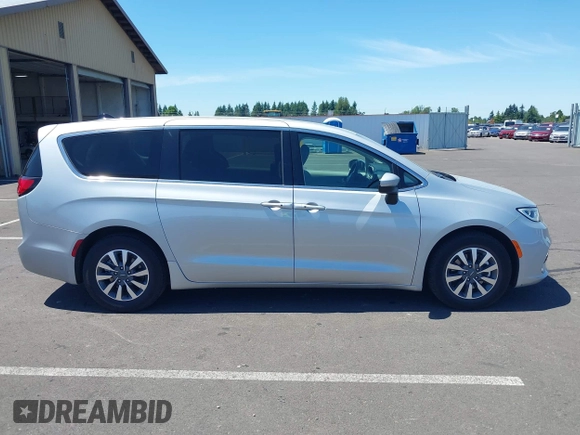 2023 Chrysler Pacifica Hybrid Touring L with VIN 2C4RC1L75PR614460, listed as a IAAI auction lot 42628545 with 68,668 mi miles and . Bid and sale history available at DreamBid. Image 13.