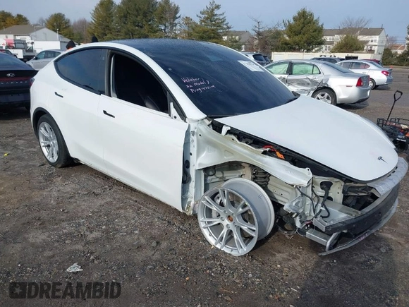 2022 Tesla Model Y Long Range z VIN 7SAYGDEE0NF435252, wystawiony jako IAAI lot #41449612 z przebiegiem 48 671 mil mil oraz . Historia ofert i sprzedaży dostępna na DreamBid. Obrazek 1.