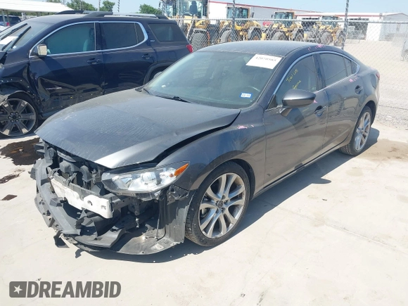2014 Mazda 6 i Touring with VIN JM1GJ1V55E1105379, listed as a IAAI auction lot 42010585 with 153,870 mi miles and . Bid and sale history available at DreamBid. Image 2.