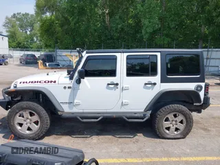 2015 Jeep Wrangler Unlimited Rubicon z VIN 1C4BJWFGXFL755810, wystawiony jako IAAI lot #42495531 z przebiegiem 109 668 mil mil oraz . Historia ofert i sprzedaży dostępna na DreamBid. Obrazek 14.