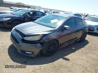 2016 Ford Focus SE with VIN 1FADP3F21GL268058, listed as a IAAI auction lot 42053944 with 103,785 mi miles and . Bid and sale history available at DreamBid. Image 2.