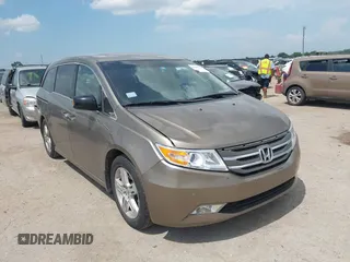 2012 Honda Odyssey Touring with VIN 5FNRL5H90CB063846, listed as a IAAI auction lot 42687040 with 171,526 mi miles and . Bid and sale history available at DreamBid. Image 1.