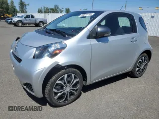 2012 Scion iQ with VIN JTNJJXB02CJ010966, listed as a Copart auction lot 58816705 with 81,591 mi miles and Salvage title. Bid and sale history available at DreamBid. Image 1.