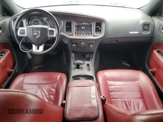 2013 Dodge Charger SXT z VIN 2C3CDXHG6DH525694, wystawiony jako Copart lot #54911495 z przebiegiem 189 992 mil mil oraz Szkoda całkowita • Salvage title. Historia ofert i sprzedaży dostępna na DreamBid. Obrazek 8.