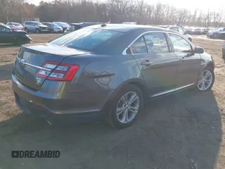 2015 Ford Taurus SEL with VIN 1FAHP2H86FG174102, listed as a IAAI auction lot 40997366 with 132,543 mi miles. Bid and sale history available at carsss.com. Image 4.