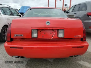 2002 Cadillac Eldorado z VIN 1G6EC129X2B106142, wystawiony jako Copart lot #74424164 z przebiegiem Nie podano mil oraz Szkody całkowita. Historia ofert i sprzedaży dostępna na DreamBid. Obrazek 6.