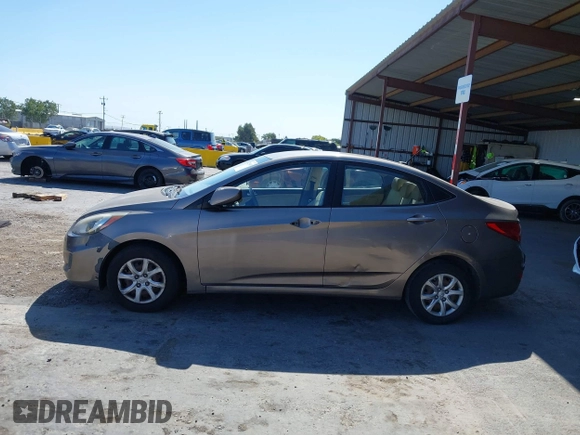 2014 Hyundai Accent GLS z VIN KMHCT4AE9EU671748, wystawiony jako IAAI lot #42356469 z przebiegiem 179 390 mil mil oraz . Historia ofert i sprzedaży dostępna na DreamBid. Obrazek 14.