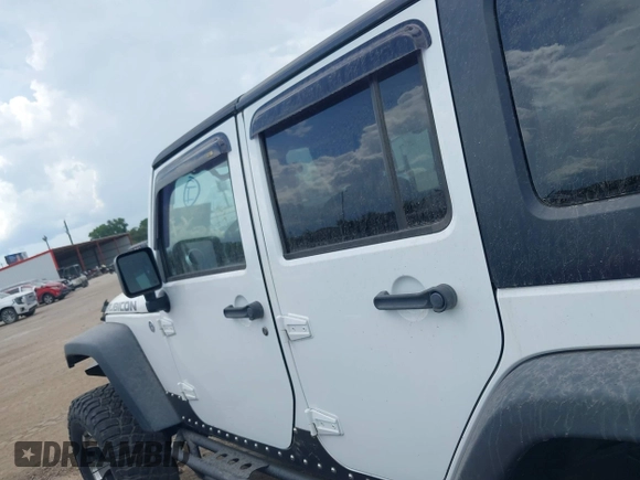 2011 Jeep Wrangler Unlimited Rubicon with VIN 1J4BA6H10BL536027, listed as a IAAI auction lot 42567901 with 164,487 mi miles and . Bid and sale history available at DreamBid. Image 14.