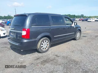 2014 Chrysler Town & Country Touring with VIN 2C4RC1BG0ER461081, listed as a IAAI auction lot 42157023 with 220,955 mi miles. Bid and sale history available at carsss.com. Image 4.