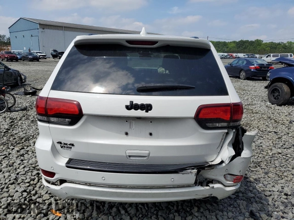 2018 Jeep Grand Cherokee Altitude with VIN 1C4RJFAGXJC122688, listed as a Copart auction lot 61290525 with 106,671 mi miles and Salvage title. Bid and sale history available at DreamBid. Image 6.
