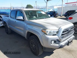 2018 Toyota Tacoma SR5 with VIN 3TMAZ5CN6JM056201, listed as a IAAI auction lot 41626663 with 55,599 mi miles and . Bid and sale history available at DreamBid. Image 1.