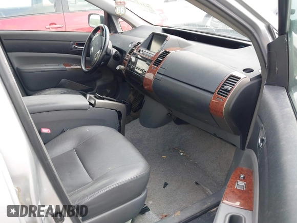 2007 Toyota Prius z VIN JTDKB20U873273942, wystawiony jako IAAI lot #42113046 z przebiegiem 126 635 mil mil oraz . Historia ofert i sprzedaży dostępna na DreamBid. Obrazek 5.