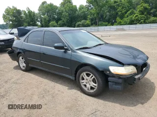 1999 Honda Accord LX with VIN 1HGCG6650XA028790, listed as a Copart auction lot 61014405 with 362,319 mi miles and Salvage title. Bid and sale history available at DreamBid. Image 4.