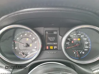 2012 Jeep Grand Cherokee SRT8 with VIN 1C4RJFDJ0CC351195, listed as a Copart auction lot 72794454 with 104,672 mi miles and Salvage Title. Bid and sale history available at carsss.com. Image 9.