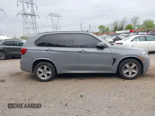 2016 BMW X5 xDrive50i with VIN 5UXKR6C57G0J80370, listed as a IAAI auction lot 42040278 with 99,071 mi miles. Bid and sale history available at carsss.com. Image 14.