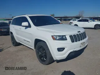 2015 Jeep Grand Cherokee Altitude z VIN 1C4RJFAG2FC797720, wystawiony jako IAAI lot #41846191 z przebiegiem 133 423 mil mil oraz . Historia ofert i sprzedaży dostępna na DreamBid. Obrazek 1.